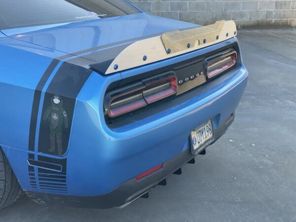 The rear end of a blue sports car