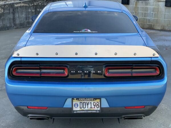 A blue car parked in a parking lot