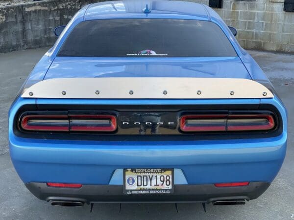 A blue car parked in a parking lot