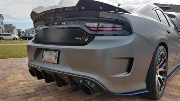 The rear end of a silver sports car