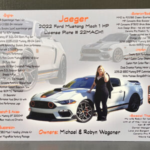 A woman stands beside a customized 2022 Ford Mustang Mach 1, showcasing modifications and specifications.